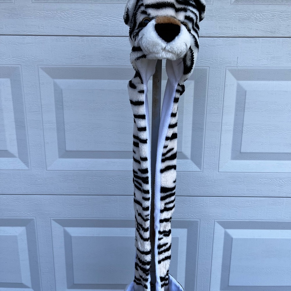 White animal print hat with animal face on front and back with scarf and mittens